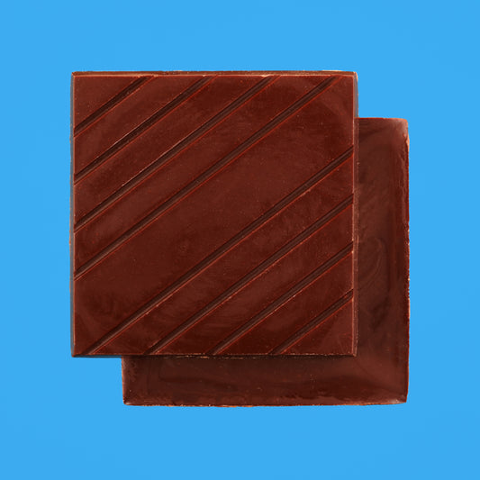 Dark chocolate bar on a blue background