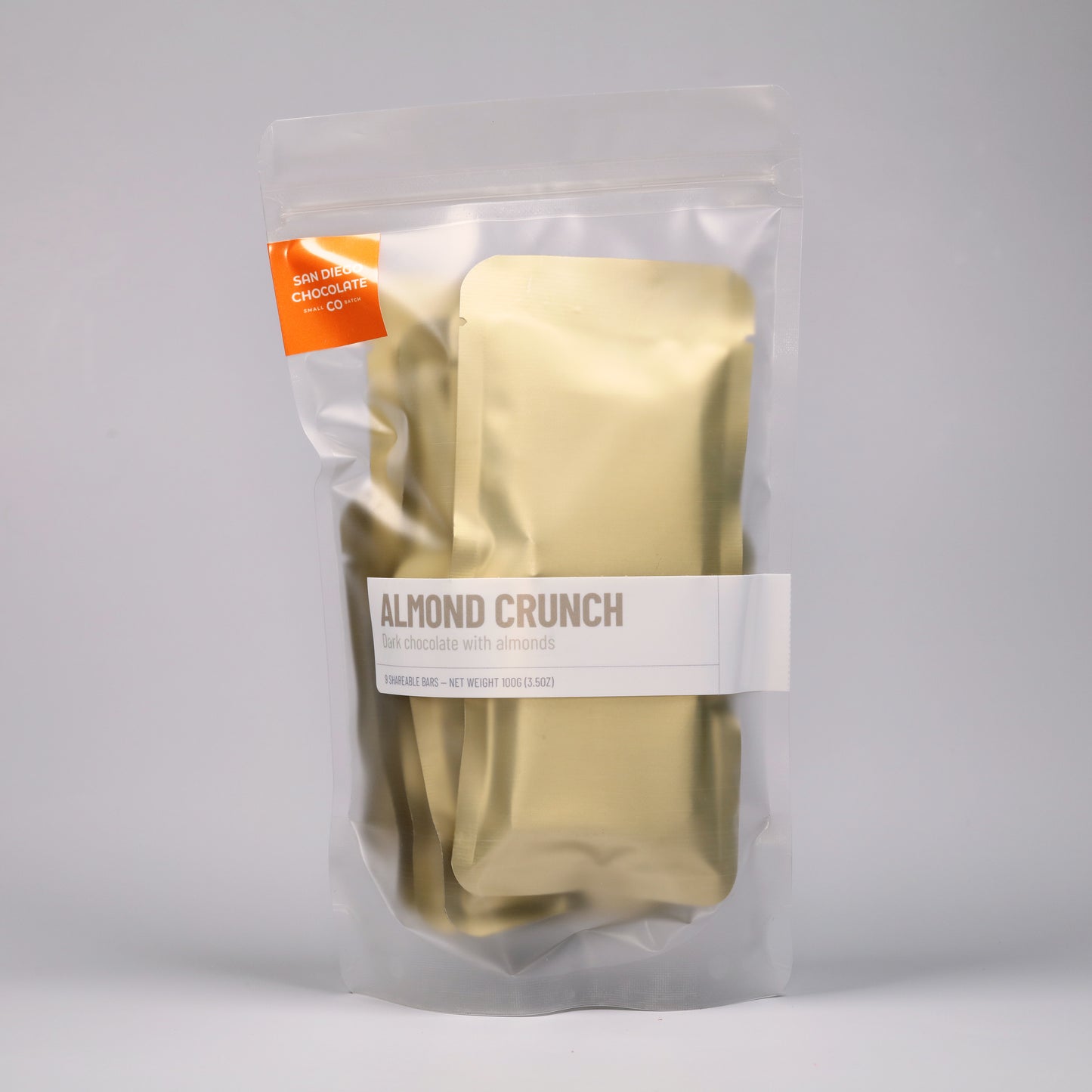 Packaged snack labeled 'Almond Crunch' on a gray background