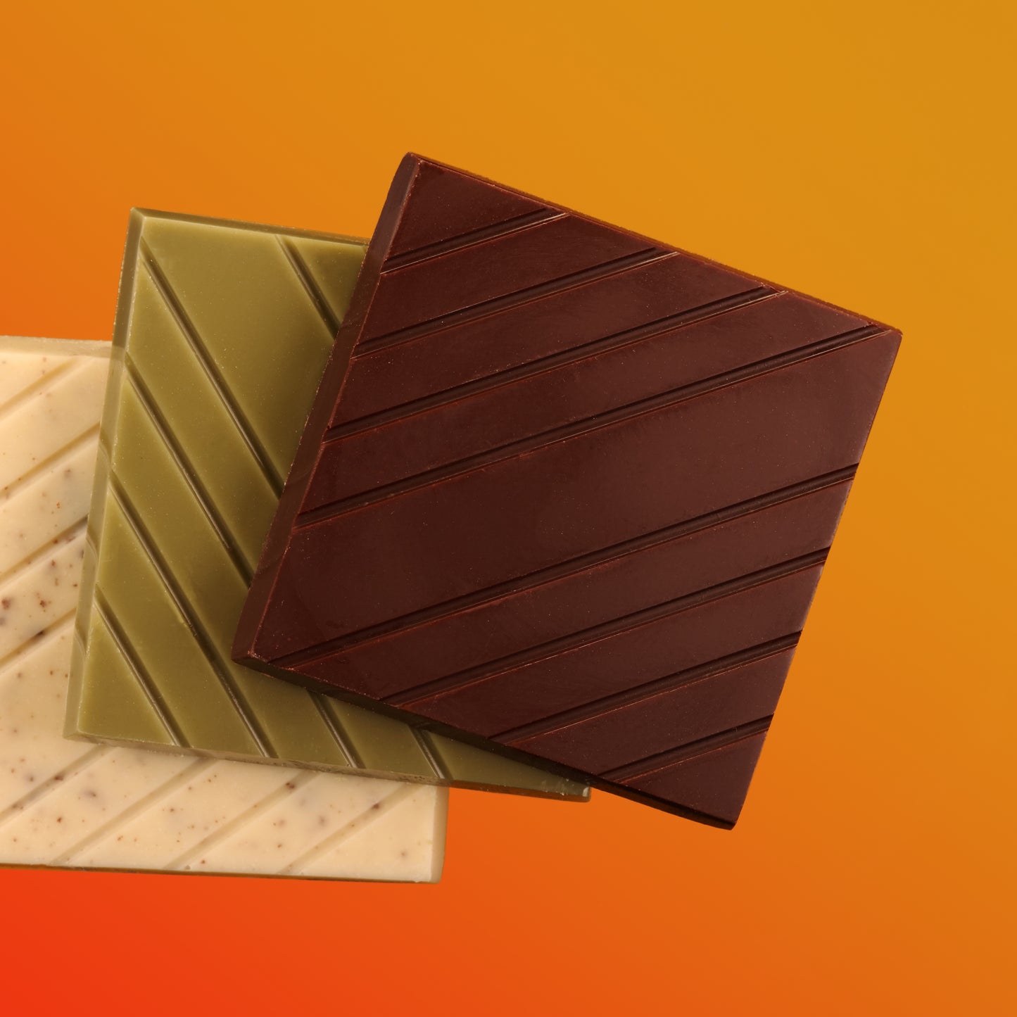 Dark, matcha and cookies and cream bars on gradient background